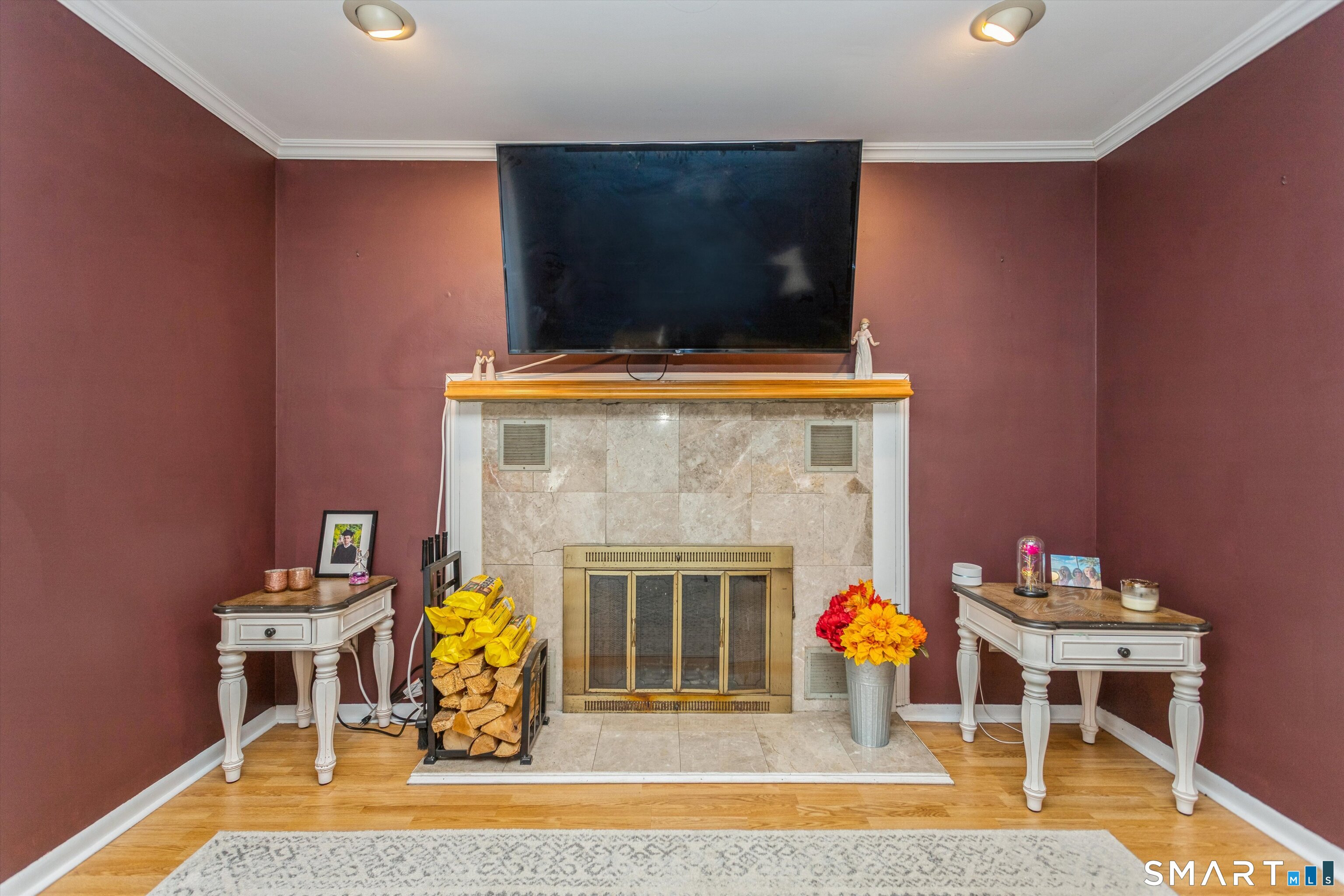 a living room with furniture and a fireplace