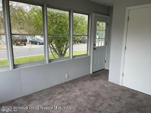 an empty room that has a window