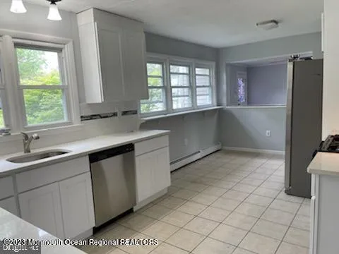 a kitchen with a sink and a window