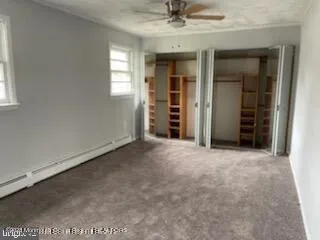 an empty room with a empty space and chandelier fan
