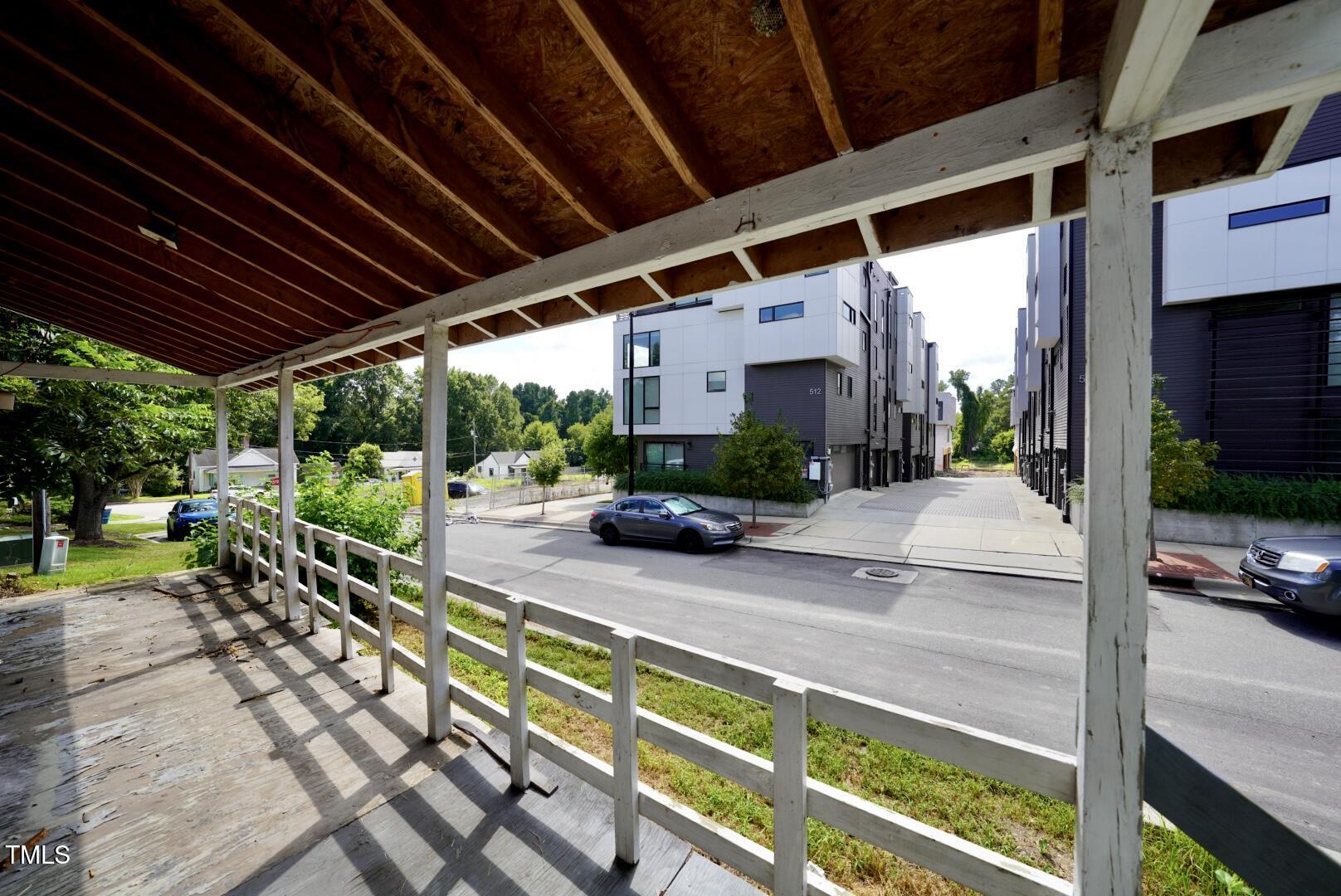 a view of a porch with furniture and a patio