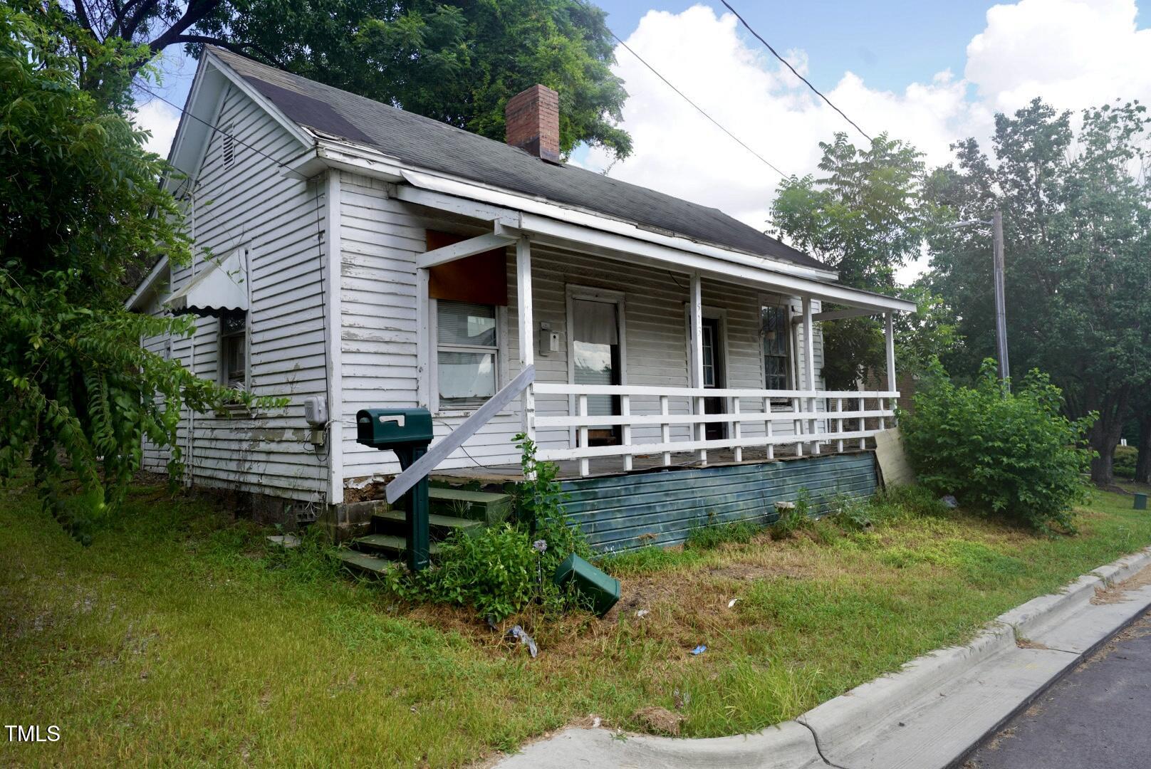 513 Gordon Street Durham, NC 27701 - Photo 5 of 10 a front view of a house with a yard table and chairs