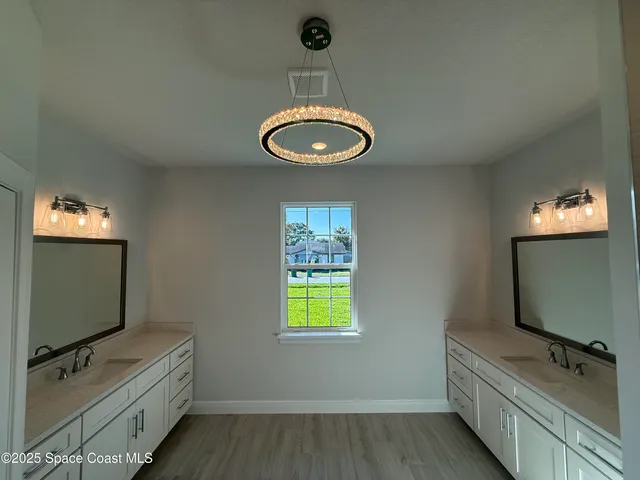 a room with bed and flat screen tv