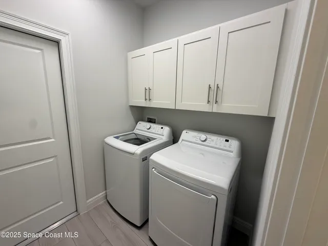 a view of storage room with washer and dryer