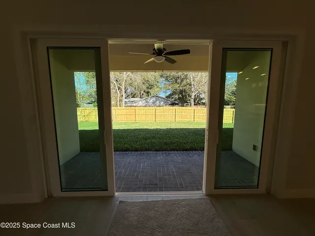 an empty room with outdoor view