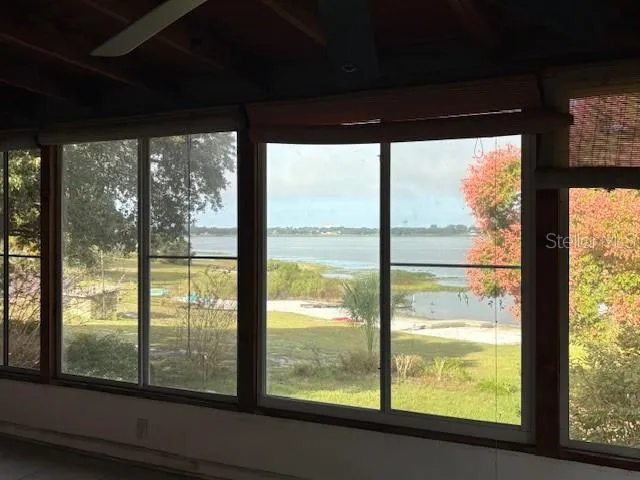 a view of an empty room and staircase
