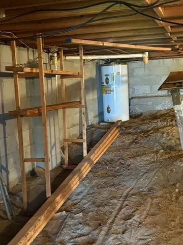 a view of a house with wooden fence