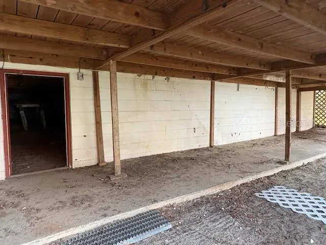 a view of a house with a yard and sitting area