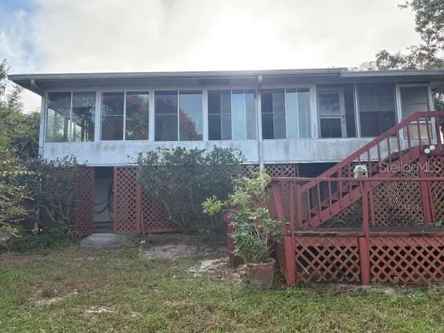 a view of a house with a tree