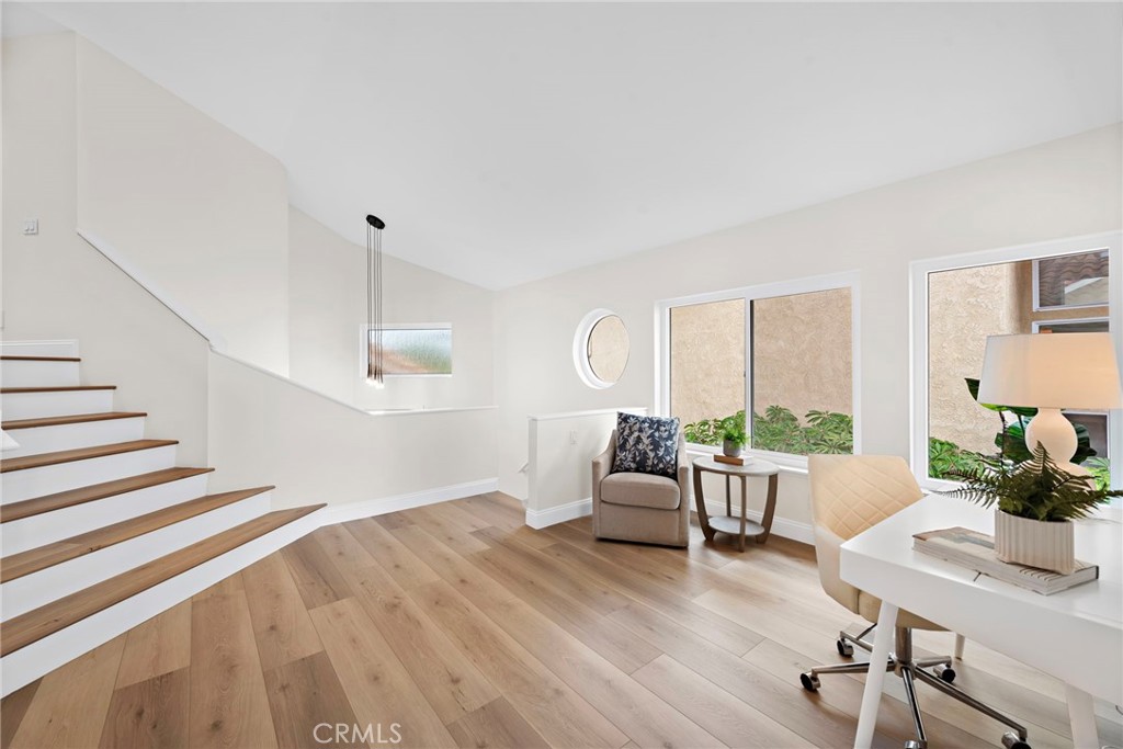27 Regatta Way Dana Point, CA 92629 - Photo 11 of 24 a living room with furniture and wooden floor