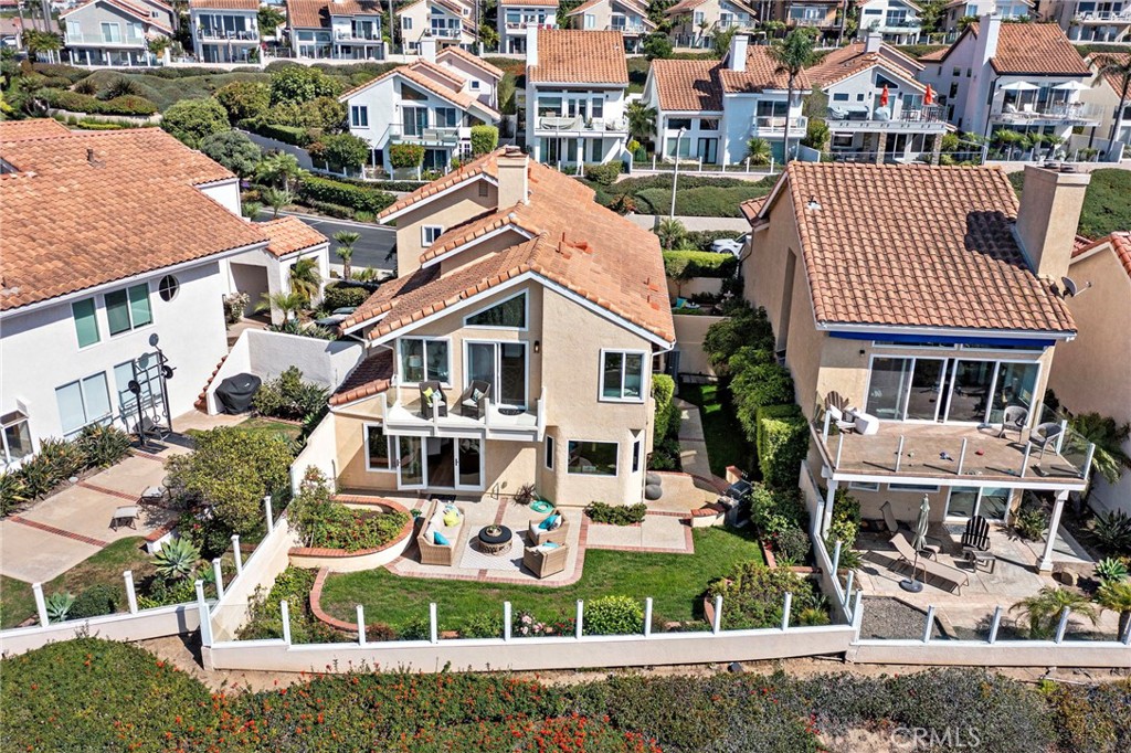 27 Regatta Way Dana Point, CA 92629 - Photo 17 of 24 an aerial view of a house with a yard table and chairs