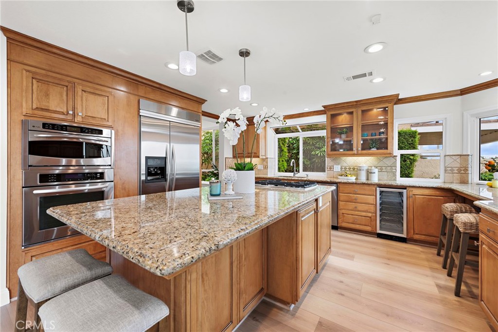 27 Regatta Way Dana Point, CA 92629 - Photo 7 of 24 a kitchen with stainless steel appliances granite countertop a sink stove and refrigerator