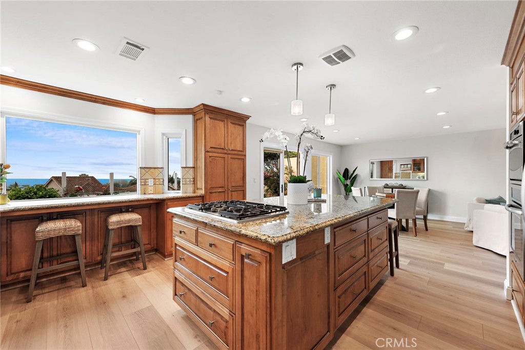 27 Regatta Way Dana Point, CA 92629 - Photo 8 of 24 a kitchen with stainless steel appliances granite countertop a stove a sink and a refrigerator