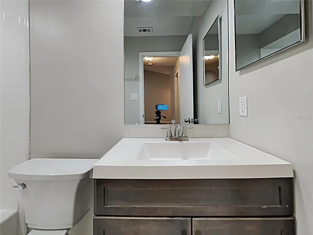 a bathroom with a sink and a toilet
