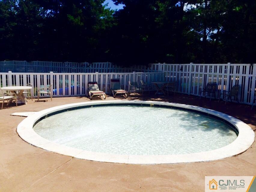 7704 Hana Road Edison, NJ 08817 - Photo 22 of 25 a view of swimming pool with outdoor seating