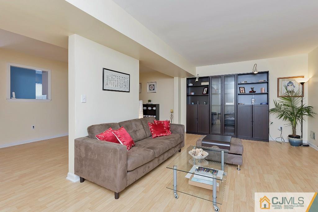 7704 Hana Road Edison, NJ 08817 - Photo 8 of 25 a living room with furniture and a flat screen tv