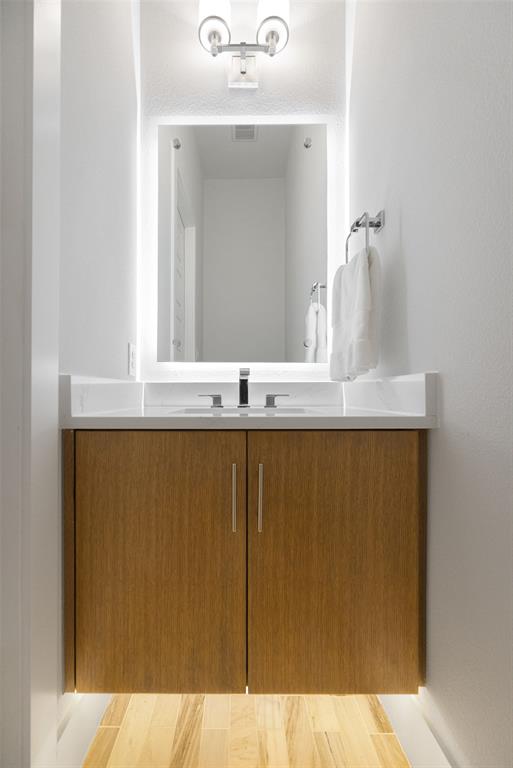 7632 Highcroft Way Plano, TX 75024 - Photo 13 of 28 a bathroom with a sink and a mirror