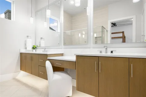 a bathroom with a sink double vanity and a mirror