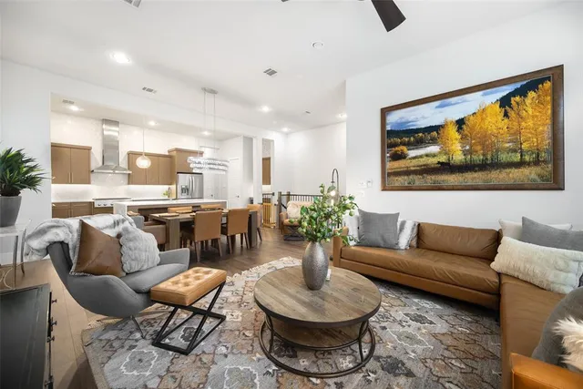 a living room with furniture and a painting