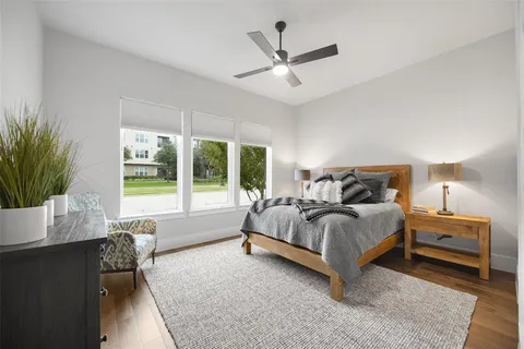 a spacious bedroom with a bed and a window