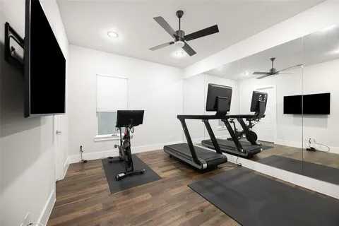 a view of a livingroom with furniture and a flat screen tv