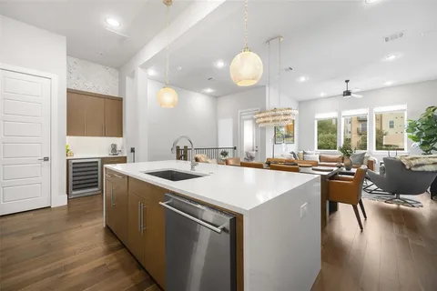 a large kitchen with lots of counter space a sink and appliances