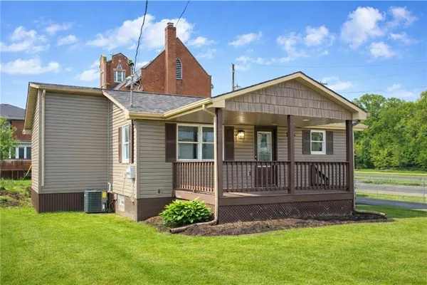a front view of a house with a yard