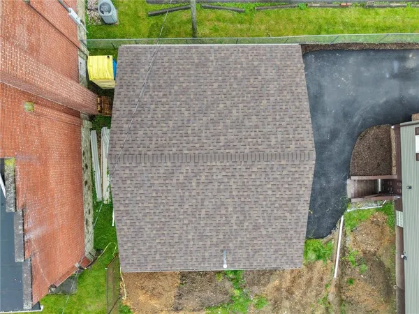 an aerial view of a house with outdoor space