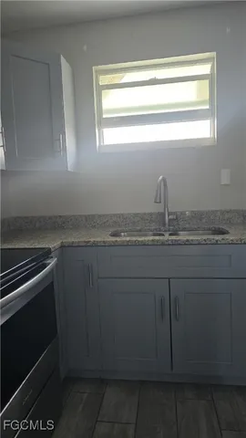 a stove top oven sitting inside of a kitchen