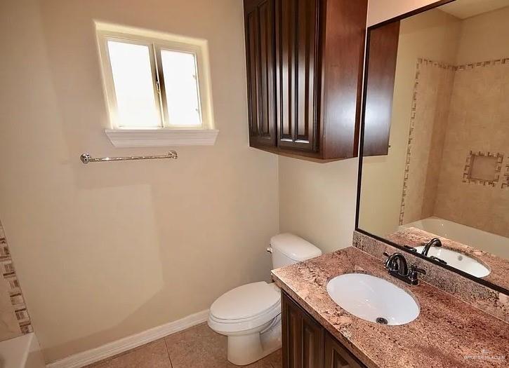 1919 West Ventura Drive Pharr, TX 78577 - Photo 13 of 20 Bathroom with vanity, light tile patterned flooring, and shower / bathtub combination
