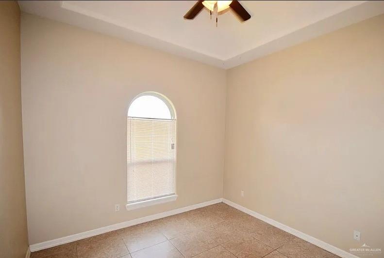 1919 West Ventura Drive Pharr, TX 78577 - Photo 14 of 20 Spare room featuring light tile patterned flooring and a ceiling fan