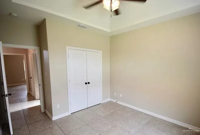 a kitchen with a refrigerator a stove and cabinets
