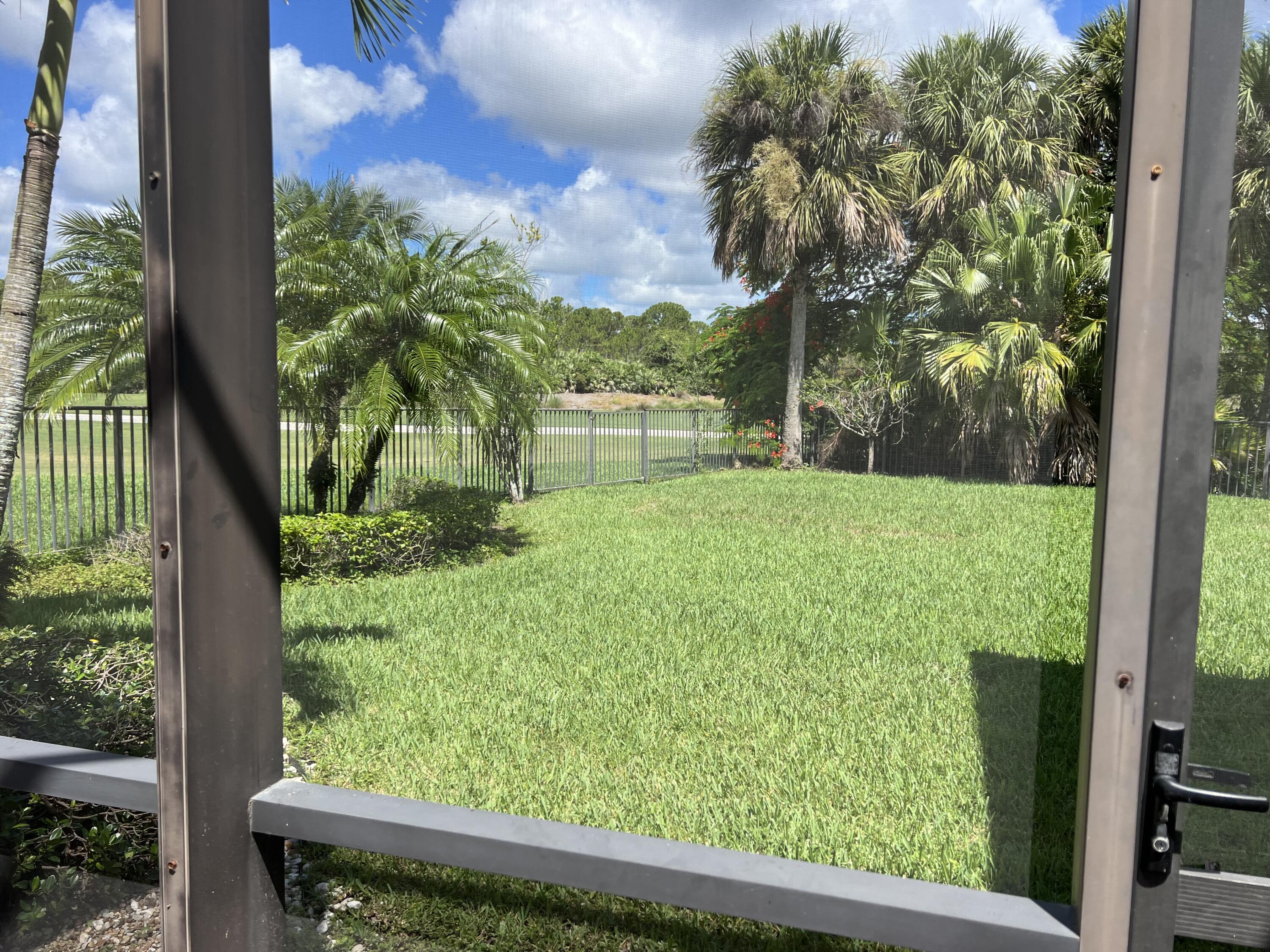 182 Rosalia Court Jupiter, FL 33478 - Photo 24 of 29 a view of yard from a window
