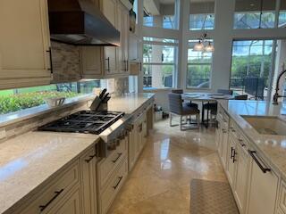 182 Rosalia Court Jupiter, FL 33478 - Photo 5 of 29 a kitchen with lots of counter top space