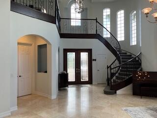 182 Rosalia Court Jupiter, FL 33478 - Photo 7 of 29 a view of entryway and hall with wooden floor