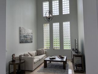 182 Rosalia Court Jupiter, FL 33478 - Photo 8 of 29 a living room with furniture and a window