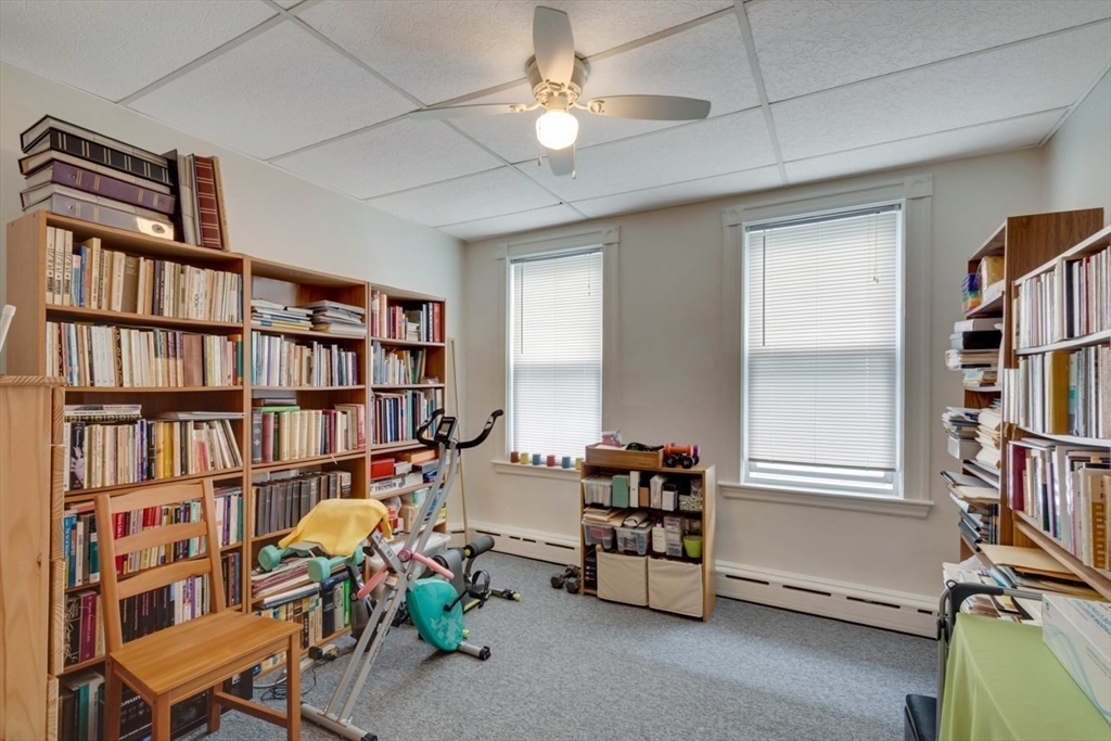 45 Jackson Road Somerville, MA 02145 - Photo 27 of 27 a living room with lots of furniture and a book shelf