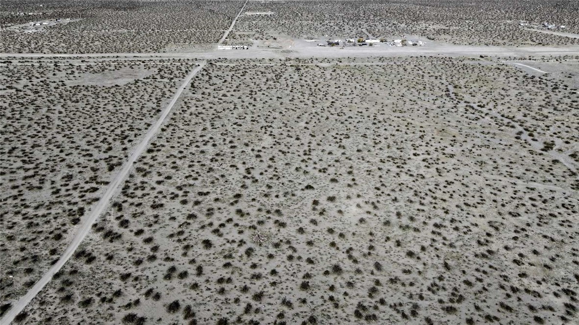 179937 Johnson Road Phelan, CA 92371 - Photo 3 of 16 a bathroom with a toilet and a shower curtain