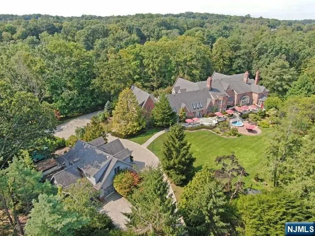 an aerial view of a house with mountain view