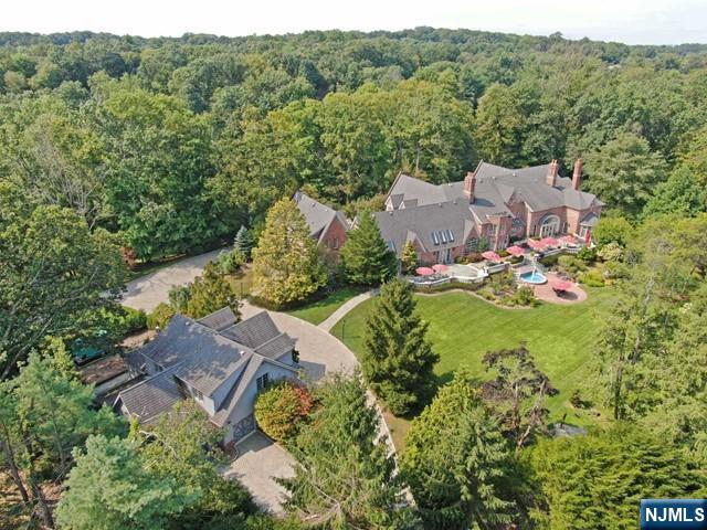 an aerial view of a house with mountain view