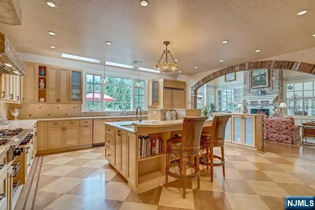 a living room with furniture a rug and a chandelier
