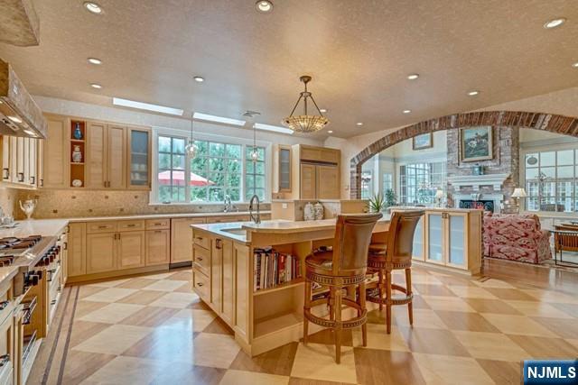 1055 High Mountain Road Franklin Lakes, NJ 07417 - Photo 15 of 42 a large kitchen with a table and chairs