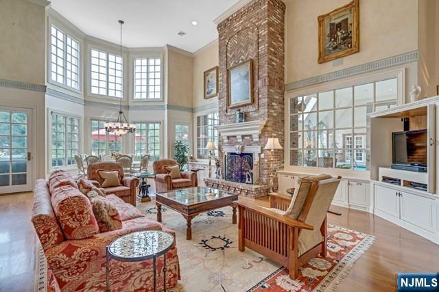 1055 High Mountain Road Franklin Lakes, NJ 07417 - Photo 16 of 42 a living room with fireplace furniture and a large window