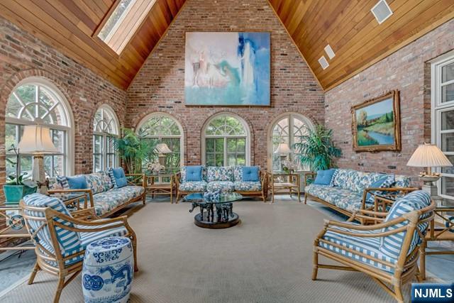 1055 High Mountain Road Franklin Lakes, NJ 07417 - Photo 18 of 42 a living room with furniture a rug and a chandelier