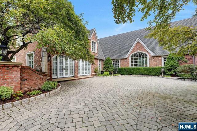 1055 High Mountain Road Franklin Lakes, NJ 07417 - Photo 32 of 42 a view of a house with a yard