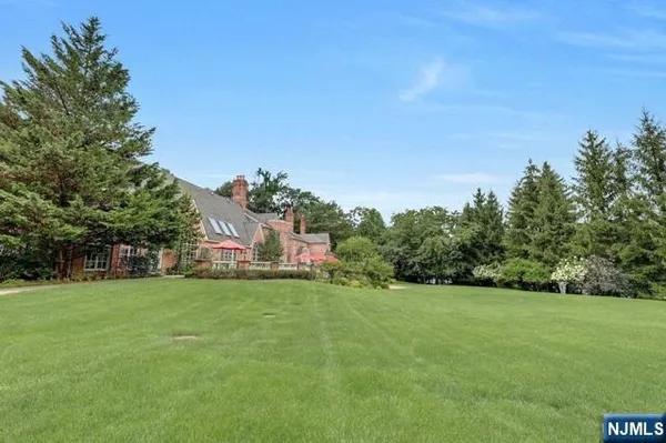 a view of a pathway of a building with a yard