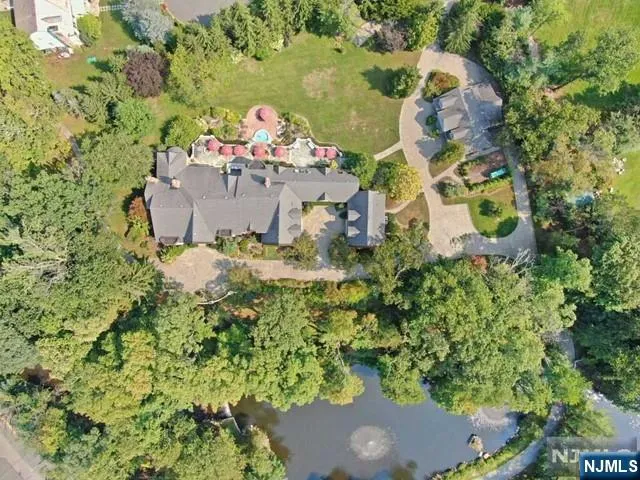 a picture of a room with a white comforter