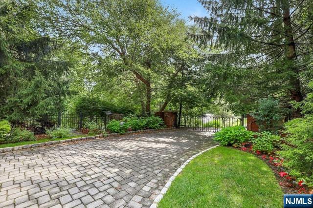 1055 High Mountain Road Franklin Lakes, NJ 07417 - Photo 5 of 42 a view of a yard with plants and trees