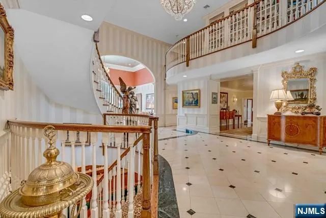 a living room with furniture fireplace and wooden floor