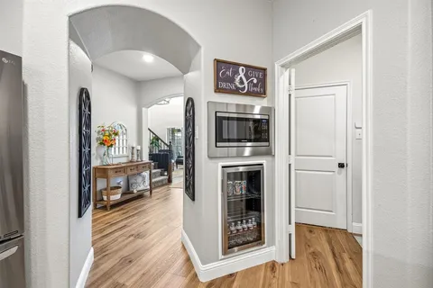a open kitchen with a stove and a refrigerator